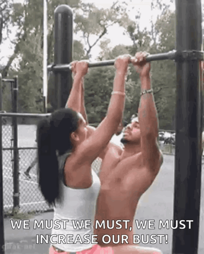 Man and Woman Doing Pull Ups