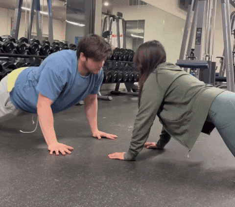 Man and Woman Doing Push Ups