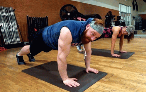 Man and Woman Doing Push Ups