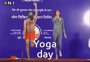 Man and Woman Doing Yoga at Yoga Day Sign