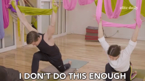 Man and Woman Doing Yoga Saying I Don't Do This Enough