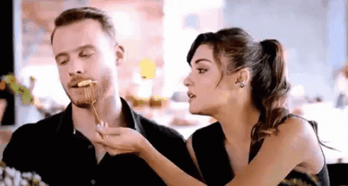 Man and Woman Eating at Table