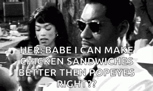 Man and Woman Eating Chicken Sandwiches