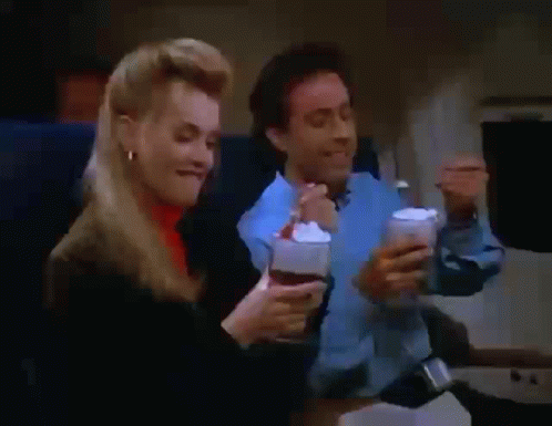 Man And Woman Eating Ice Cream On Plane GIF