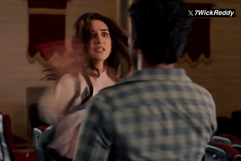 Man and Woman Fighting in Front of 7wick Reddy Sign