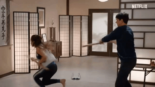 Man and Woman Fighting With Sword