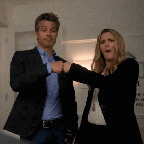 Man and Woman Fist Bumping