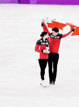 Man and Woman Holding Canadian Flag