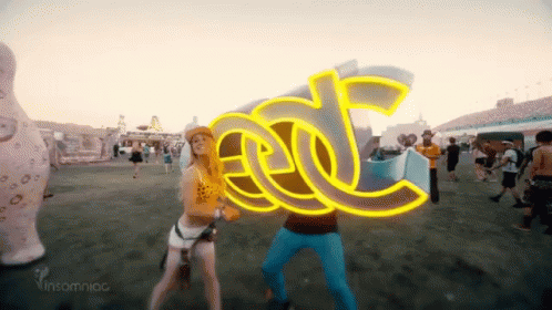 Man And Woman Holding EDC Sign GIF