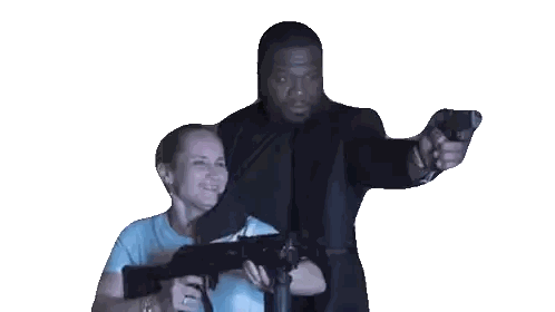 Man and Woman Holding Guns