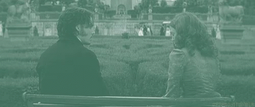 Man and Woman Holding Hands on Bench