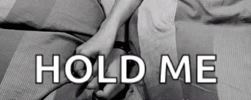 Man and Woman Holding Hands With Hold Me