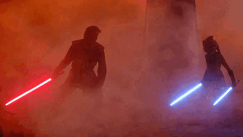 Man and Woman Holding Lightsabers