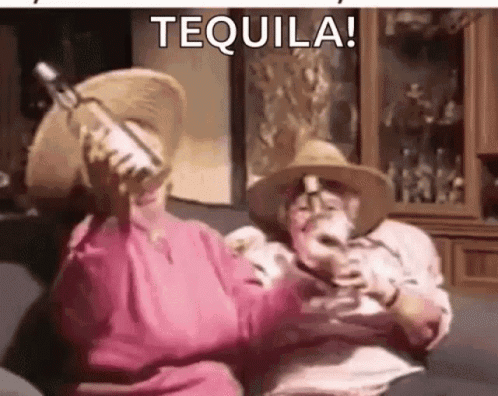 Man And Woman Holding Tequila Bottles GIF