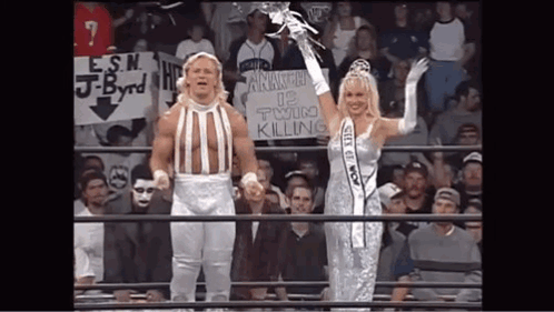 Man and Woman Holding Twin Killing Sign