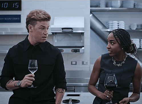 Man and Woman Holding Wine Glasses