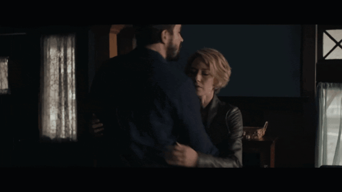 Man and Woman Hugging and Looking at Each Other