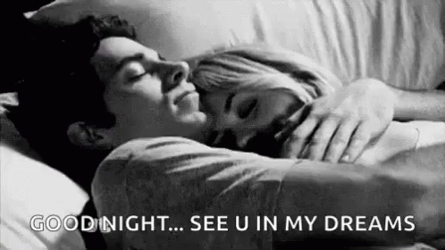 Man and Woman Hugging in Bed