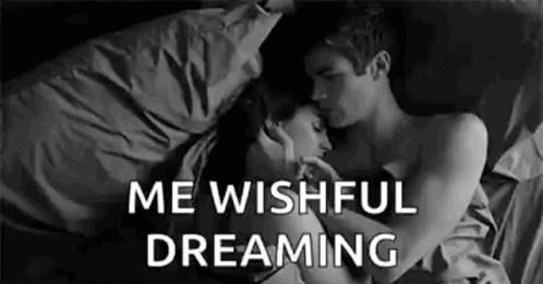 Man and Woman Hugging in Bed