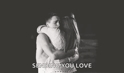 Man And Woman Hugging In Black And White Photo GIF