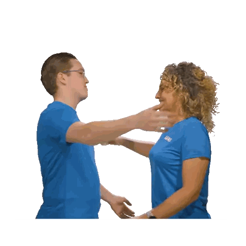 Man and Woman Hugging in Blue Shirts