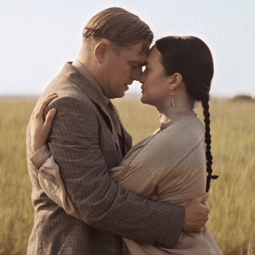 Man And Woman Hugging In Field GIF