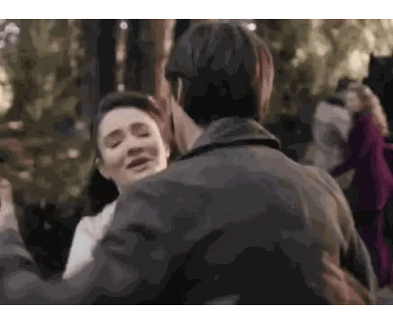 Man and Woman Hugging in Forest
