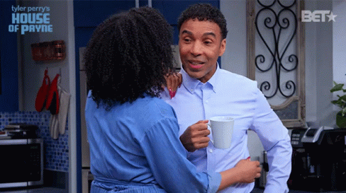 Man and Woman Hugging in Kitchen Tyler Perry's House of Payne