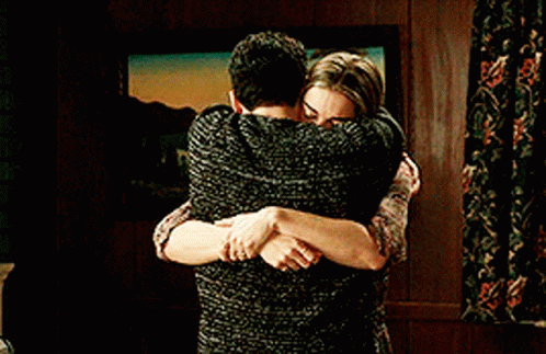 Man And Woman Hugging In Living Room GIF