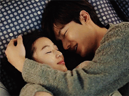 Man And Woman Hugging On Bed GIF