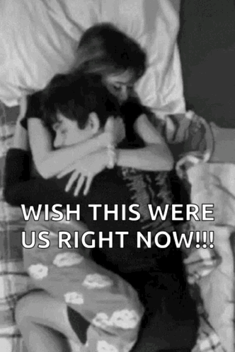 Man and Woman Hugging on Bed