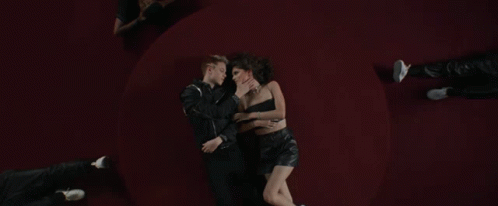 Man And Woman Hugging On Red GIF