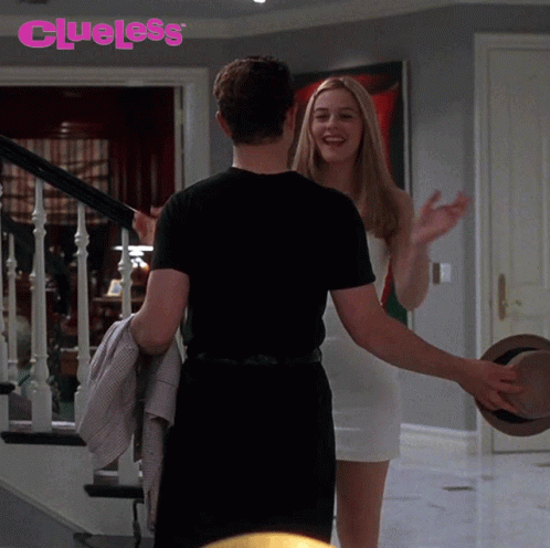 Man And Woman Hugging Saying Clueless GIF