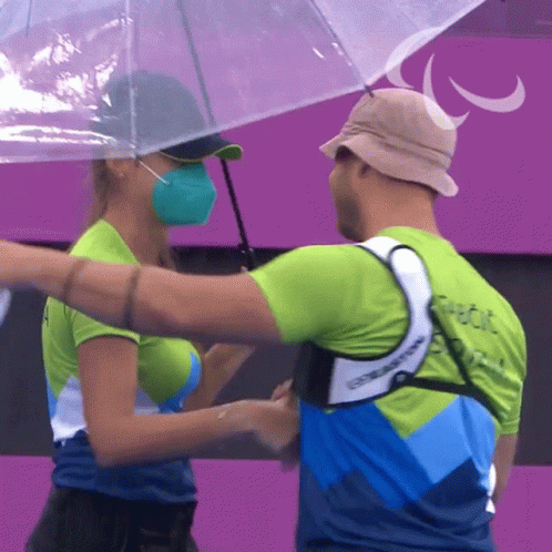 Man and Woman Hugging Under Umbrella Paralympic