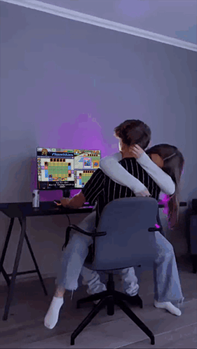 Man And Woman Hugging While Playing Video Game GIF