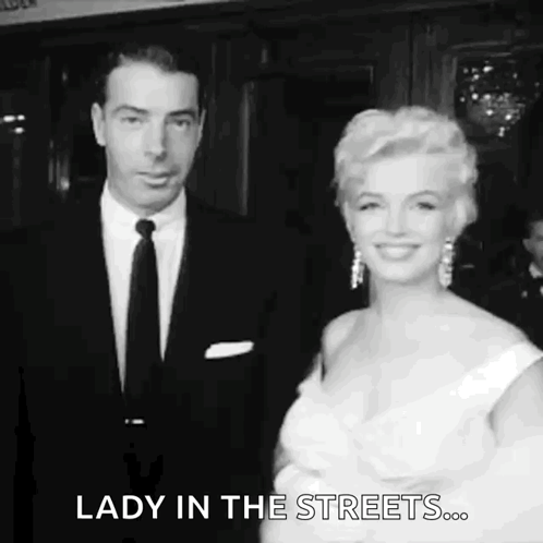 Man and Woman in Black and White Standing Together