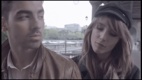 Man And Woman In Black Hat GIF