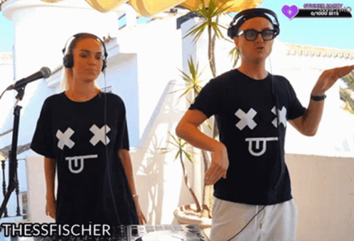 Man And Woman In Black Shirts With X And U GIF