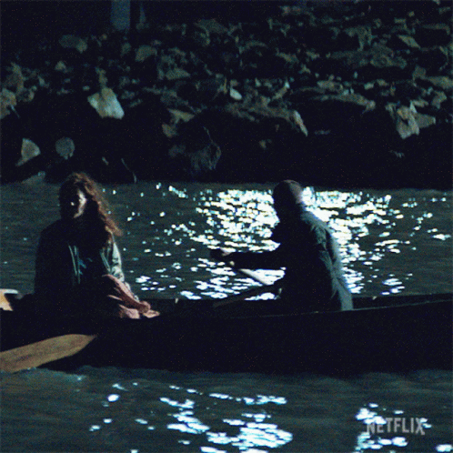 Man and Woman in Boat with Netflix