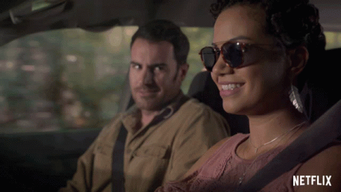Man and Woman in Car with Netflix Logo