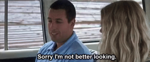 Man and Woman in Car With Sorry I'm Not Better Looking Text