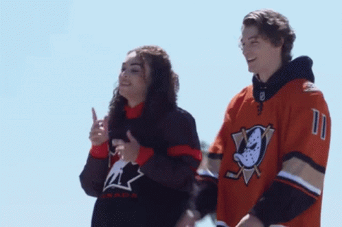 Man and Woman in Ducks Jerseys
