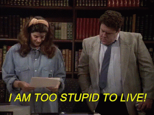 Man And Woman In Front Of Bookshelf GIF