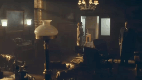 Man And Woman In Front Of Door Saying Holly GIF