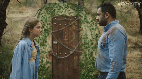 Man and Woman in Front of Door with Female Symbol