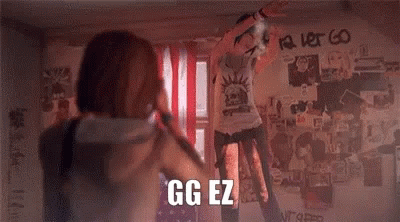 Man and Woman in Front of Graffiti Wall Saying GG EZ