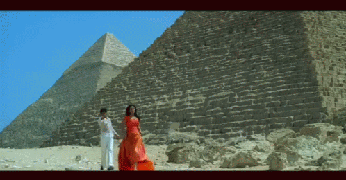 Man and Woman in Front of Pyramid