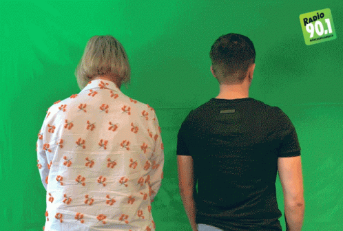 Man and Woman in Front of Radio 901 Green Screen