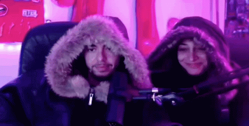 Man and Woman in Furry Hoodies
