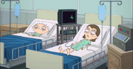 Man and Woman in Hospital Beds With IV Drips